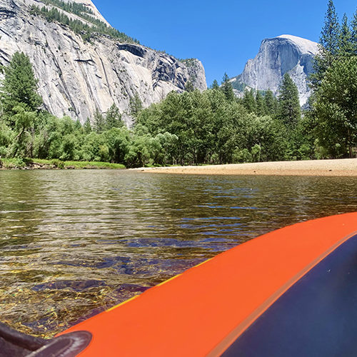 Floating along the clear waters of the Merced River, near Housekeeping Camp beach.